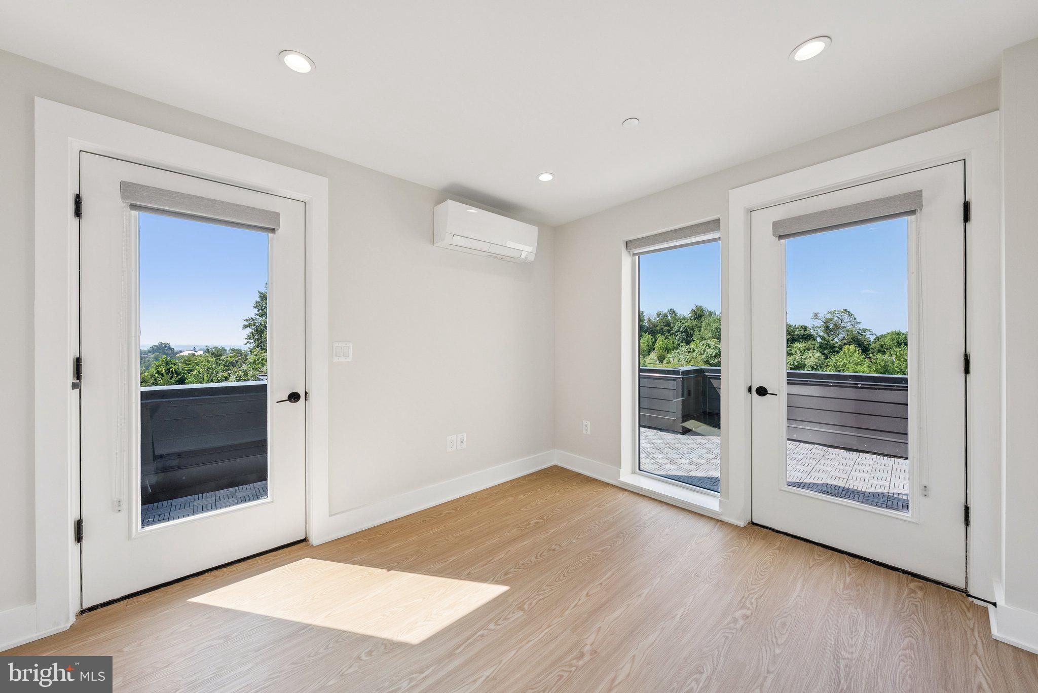 2134 Wisconsin Avenue Northwest, Unit 6 Washington, DC 20007 - Photo 23 of 40 an empty room with wooden floor and front door