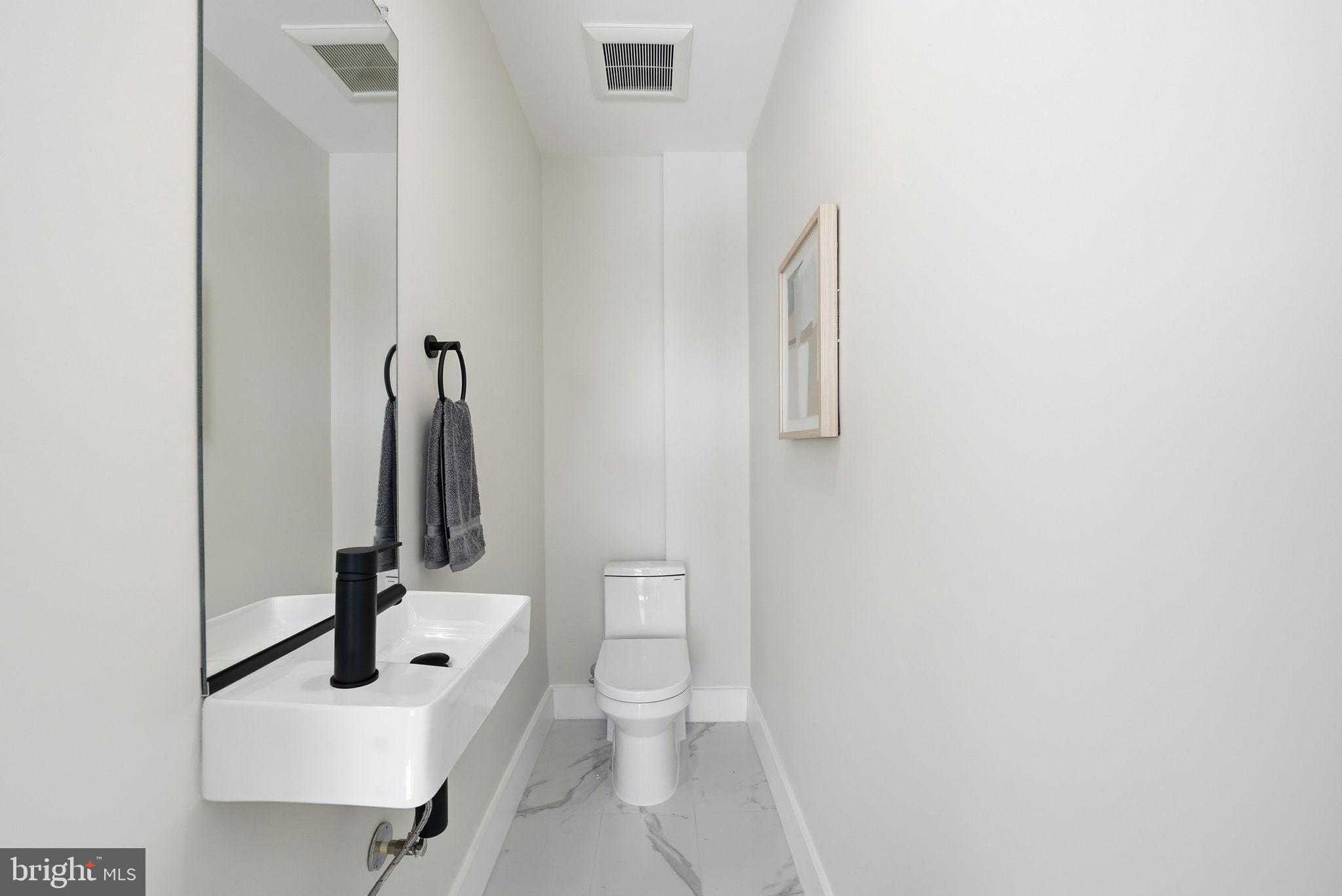 2134 Wisconsin Avenue Northwest, Unit 6 Washington, DC 20007 - Photo 25 of 43 a bathroom with a sink and a toilet