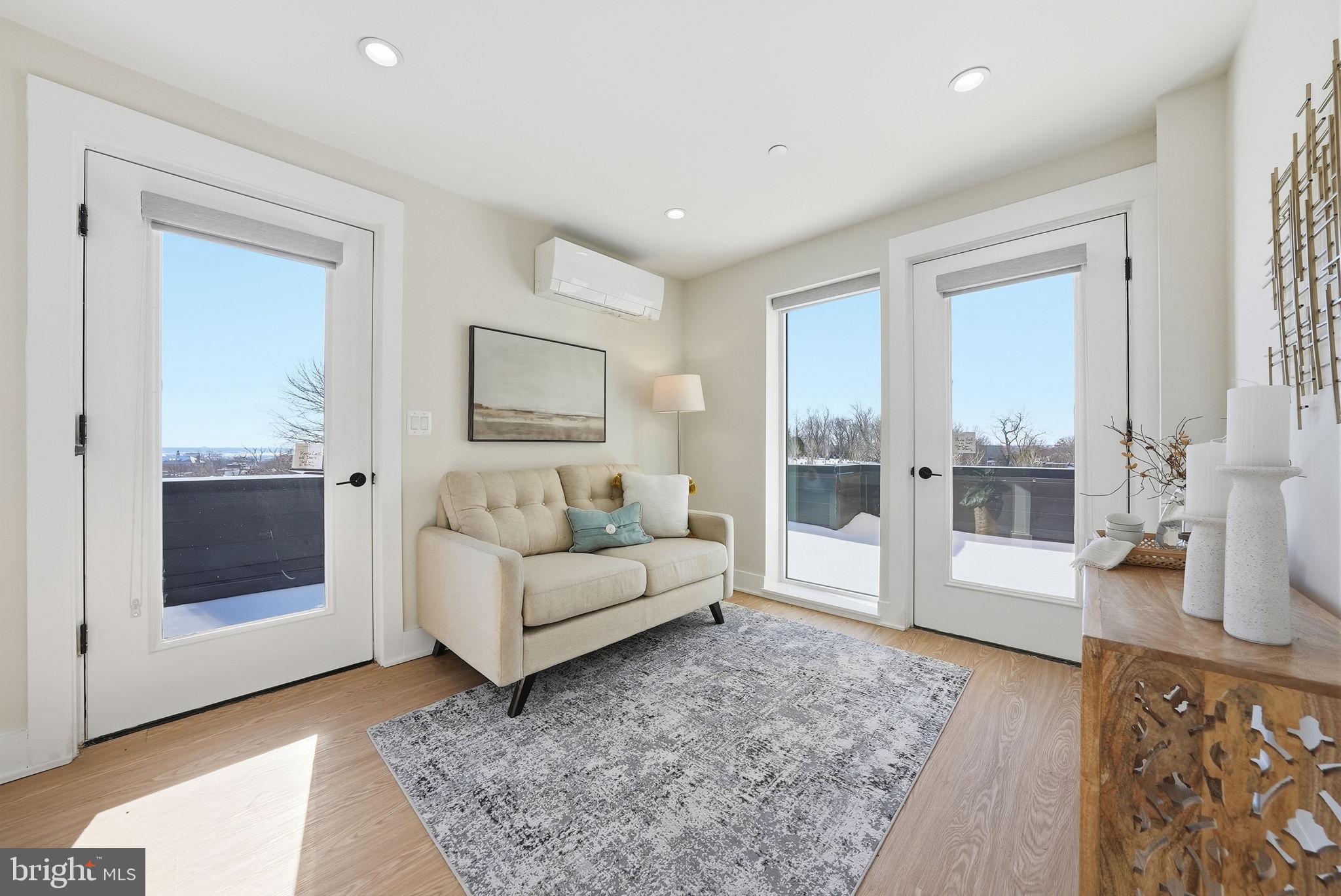 2134 Wisconsin Avenue Northwest, Unit 6 Washington, DC 20007 - Photo 26 of 43 a living room with furniture and a rug