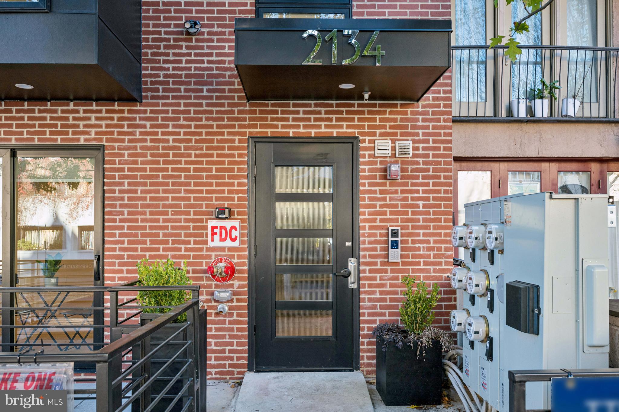 2134 Wisconsin Avenue Northwest, Unit 6 Washington, DC 20007 - Photo 33 of 43 a brick building with a door and a window