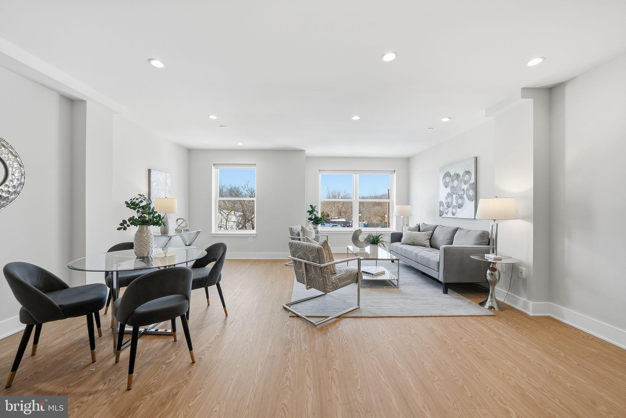 2134 Wisconsin Avenue Northwest, Unit 6 Washington, DC 20007 - Photo 4 of 43 a living room with furniture and wooden floor