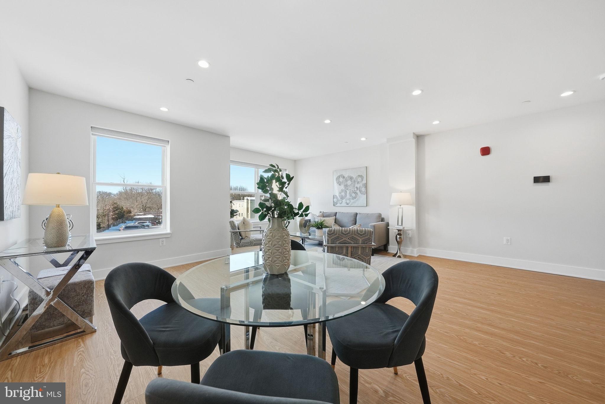 2134 Wisconsin Avenue Northwest, Unit 6 Washington, DC 20007 - Photo 5 of 43 a dining room with furniture and wooden floor