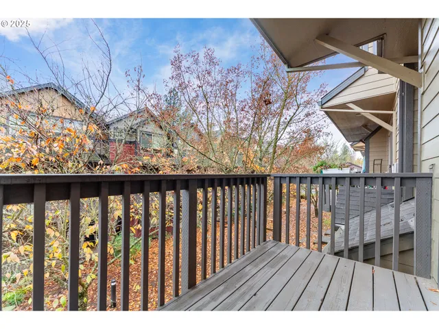 a view of wooden balcony with a swing