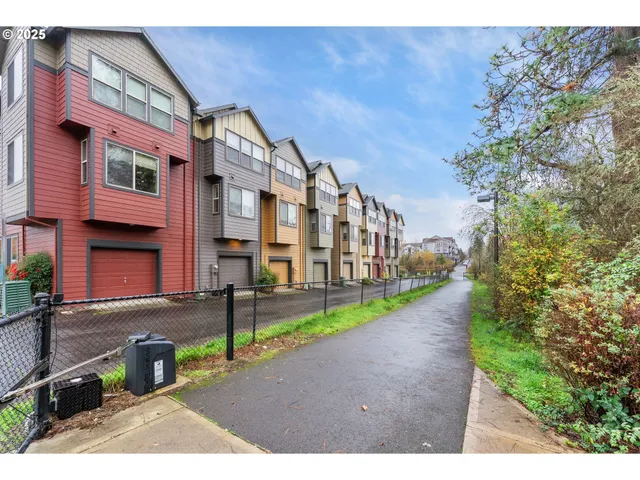 a view of a street with a building in the background