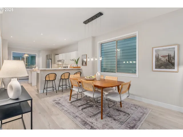 a living room with furniture a table and a potted plant