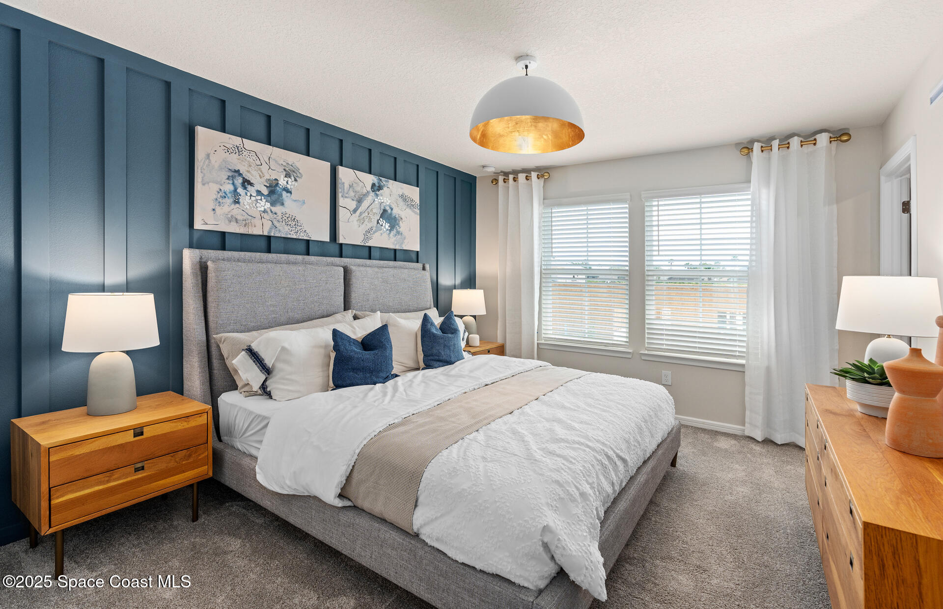 4319 Jetty Lane Palm Bay, FL 32905 - Photo 14 of 16 a bedroom with a bed and a lamp on table