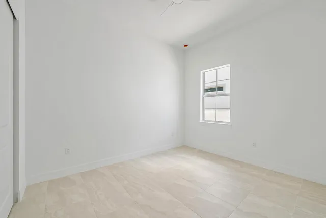 a view of a big yard with potted plants