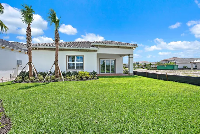 an aerial view of a house with a garden