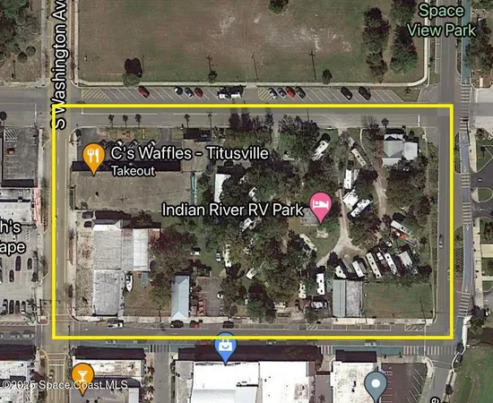 a view of yard with car parked