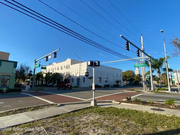a sign board on the side of the road