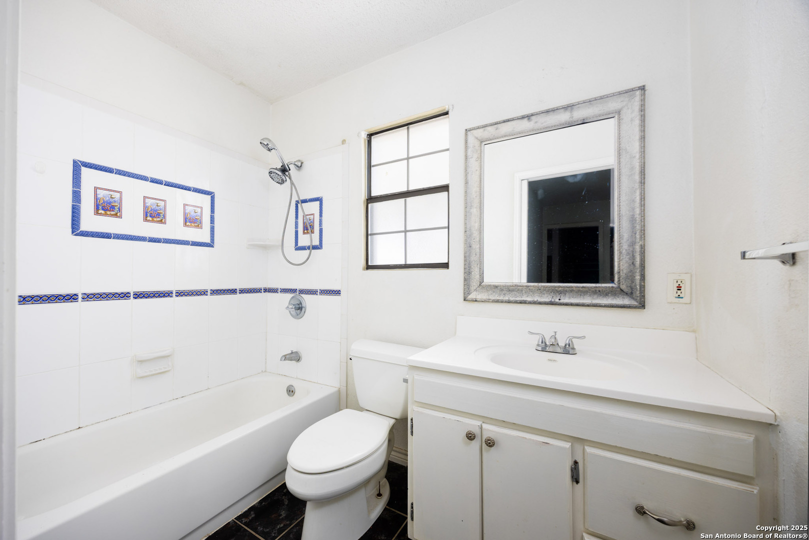 641 Weber Road Seguin, TX 78155 - Photo 13 of 27 a bathroom with a sink a toilet and a bathtub