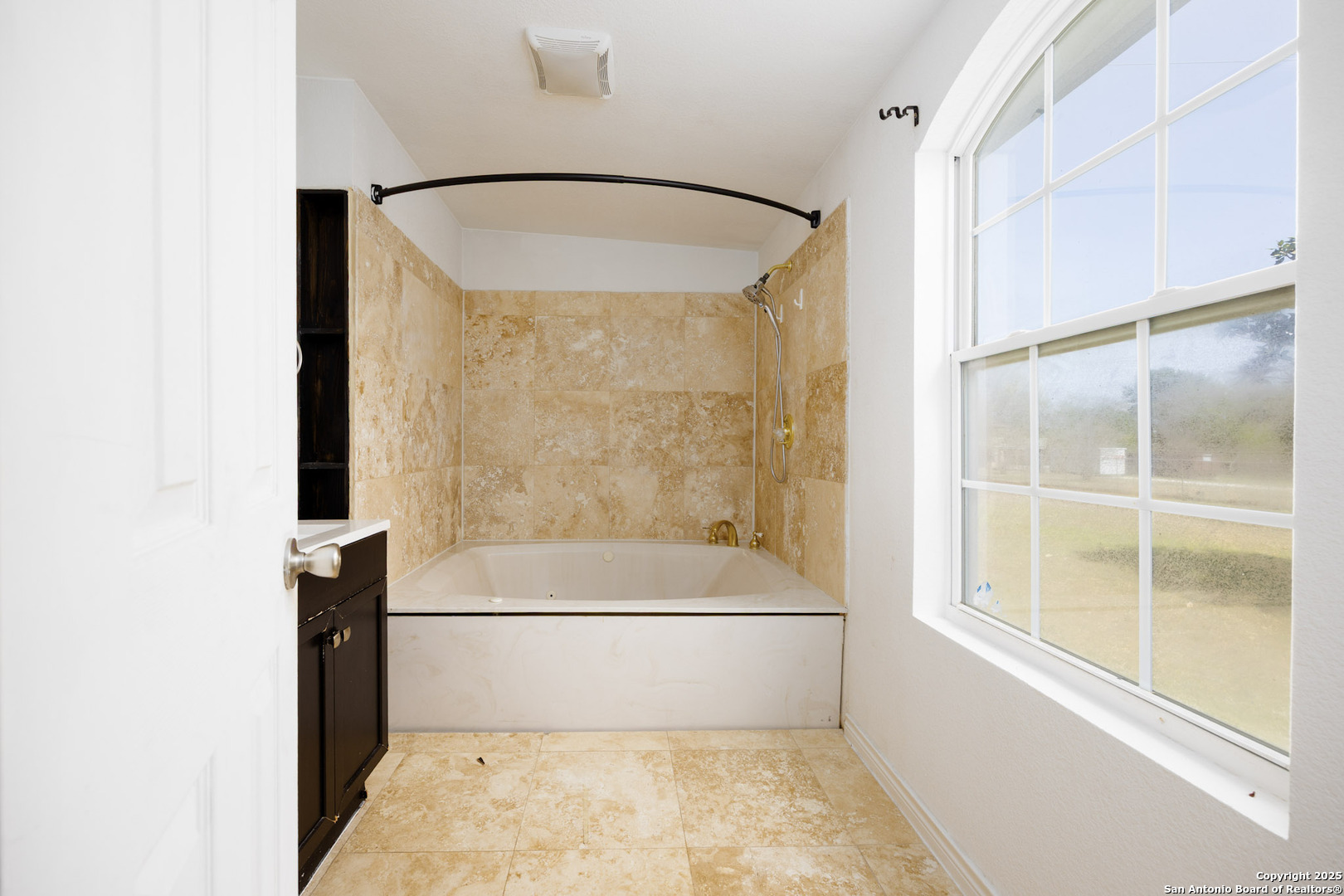 641 Weber Road Seguin, TX 78155 - Photo 18 of 27 a bathroom with a bathtub and a shower