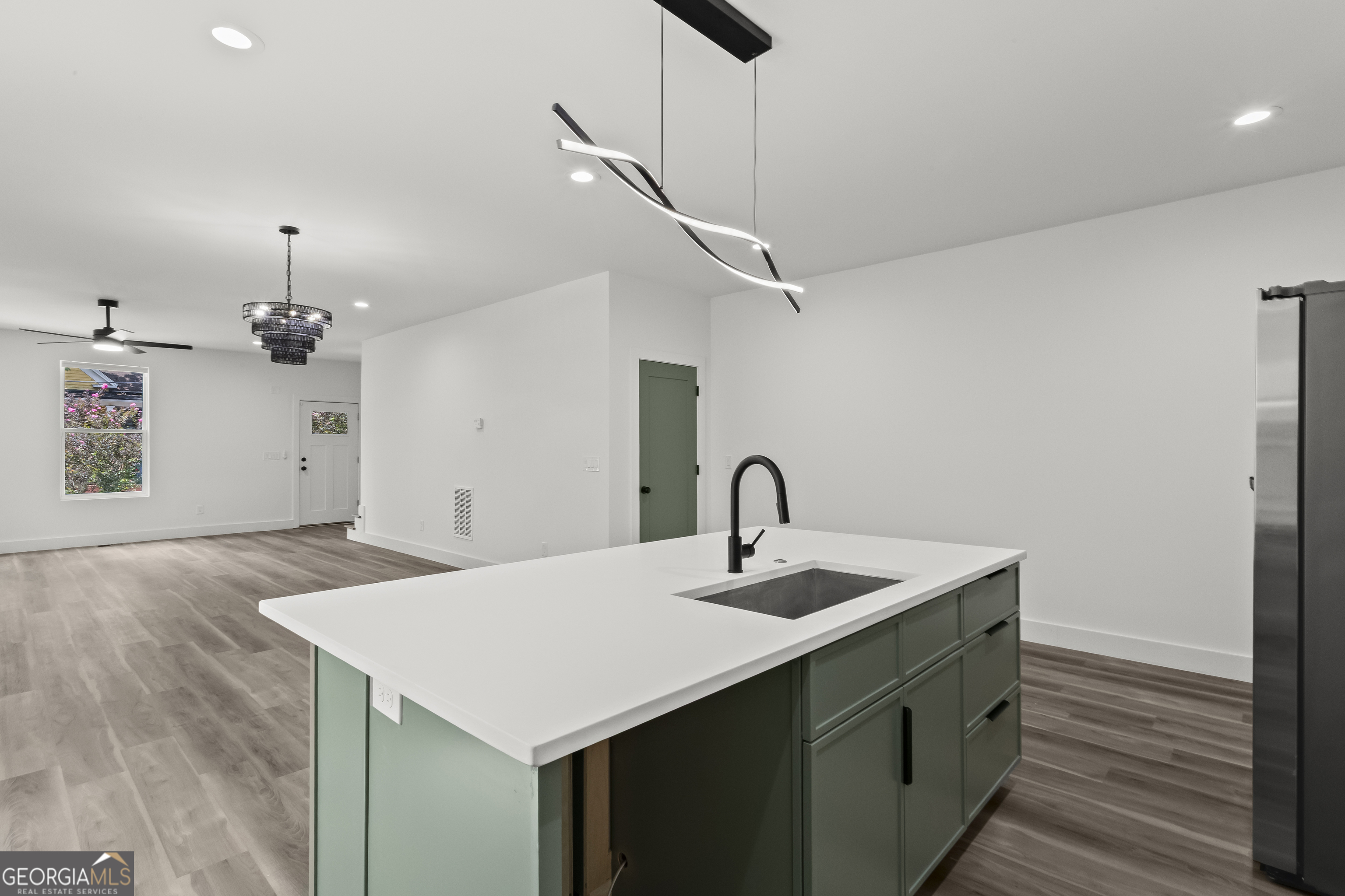 598 Formwalt Street Southwest Atlanta, GA 30312 - Photo 12 of 23 a kitchen with a sink a counter space and wooden floor