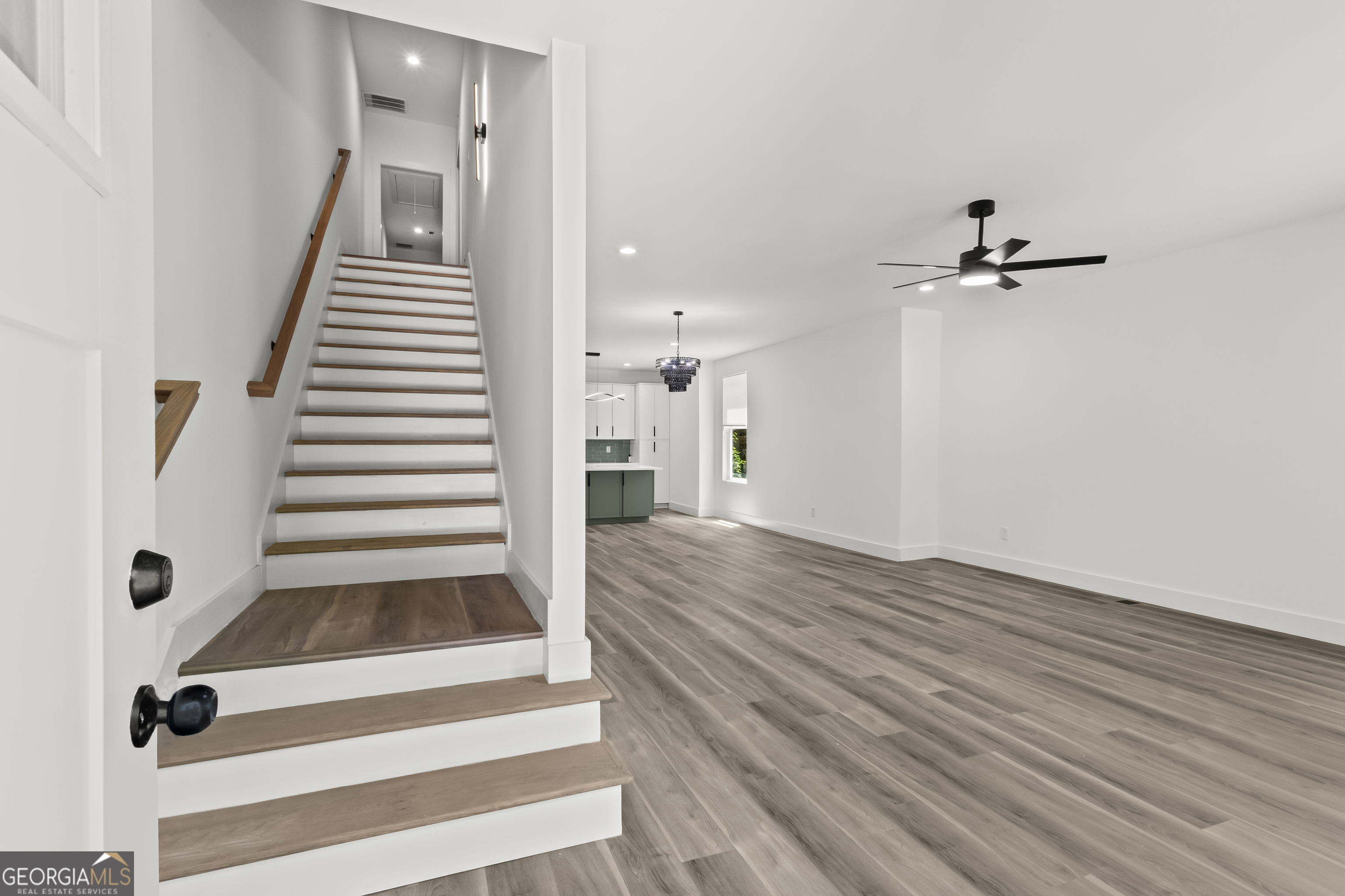 598 Formwalt Street Southwest Atlanta, GA 30312 - Photo 3 of 23 a view of a hallway with wooden floor and staircase