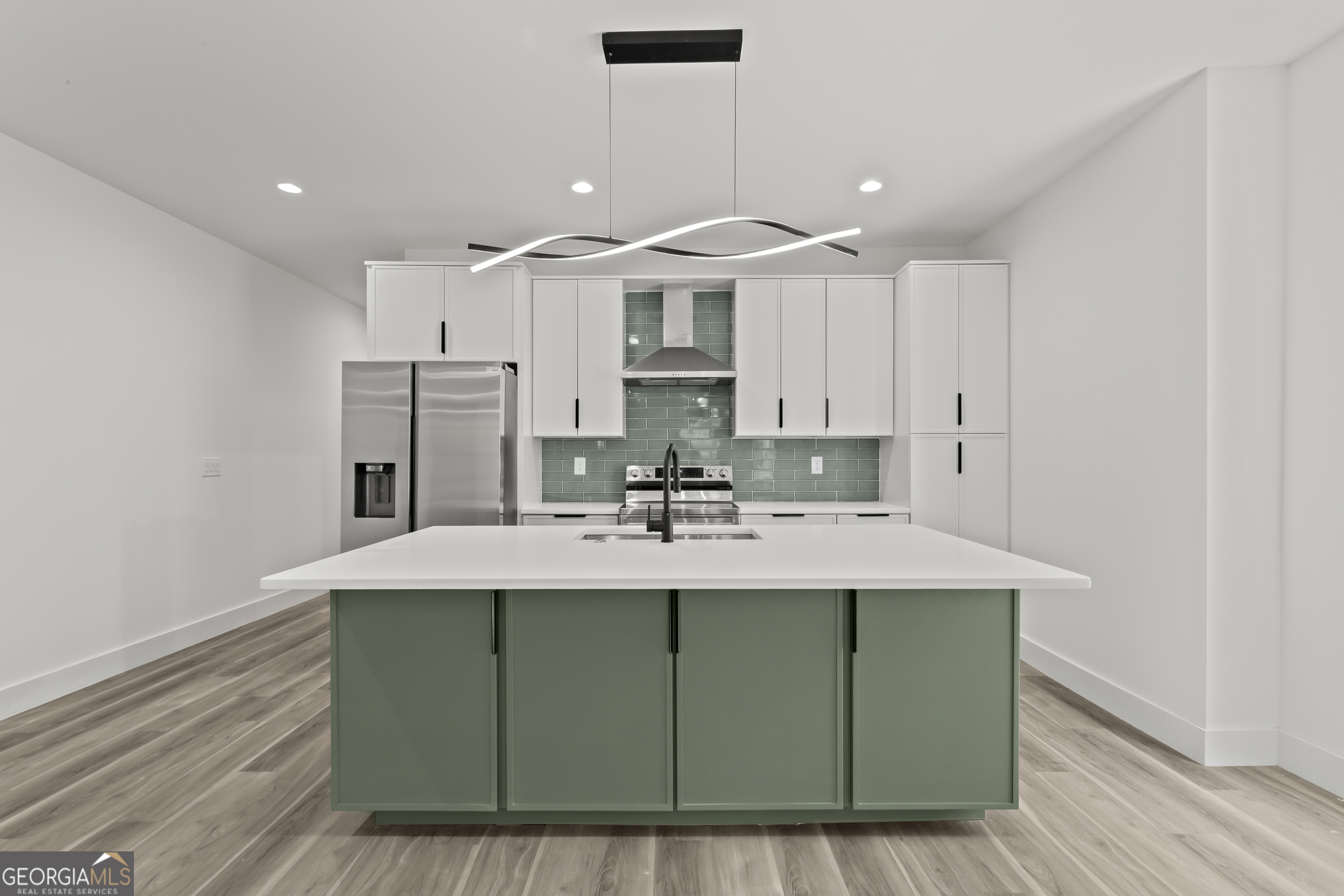 598 Formwalt Street Southwest Atlanta, GA 30312 - Photo 9 of 23 a kitchen with stainless steel appliances granite countertop a sink and a refrigerator
