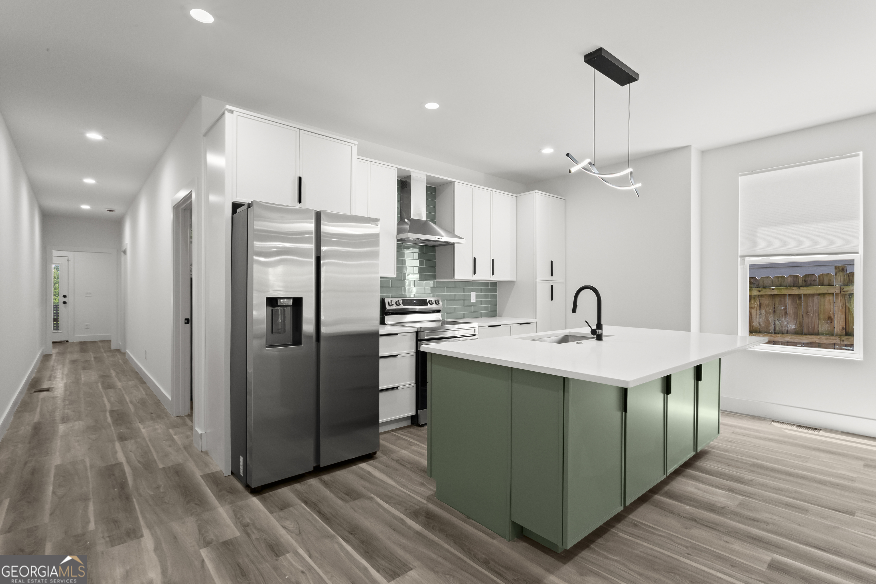 598 Formwalt Street Southwest Atlanta, GA 30312 - Photo 10 of 23 a kitchen with stainless steel appliances a sink and a refrigerator