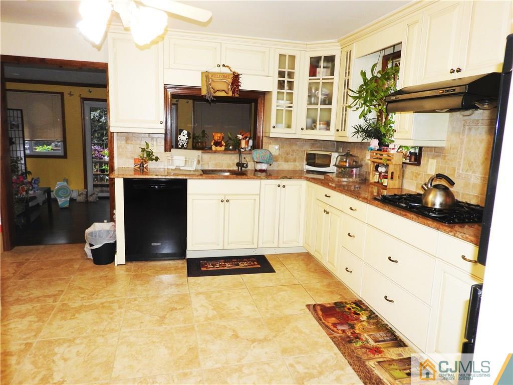 36 Fox Road Edison, NJ 08817 - Photo 8 of 21 a kitchen with a sink appliances and cabinets