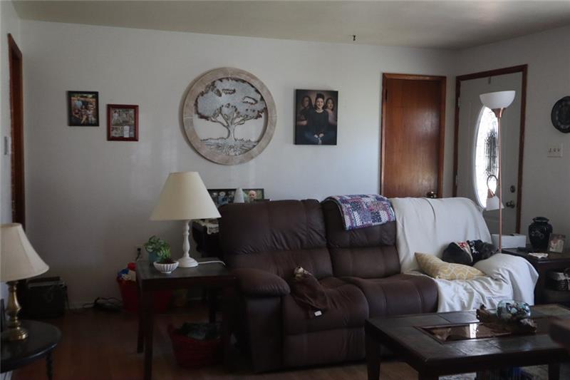 778 Katherine Street Rochester, PA 15074 - Photo 15 of 22 a living room with furniture a mirror and a lamp