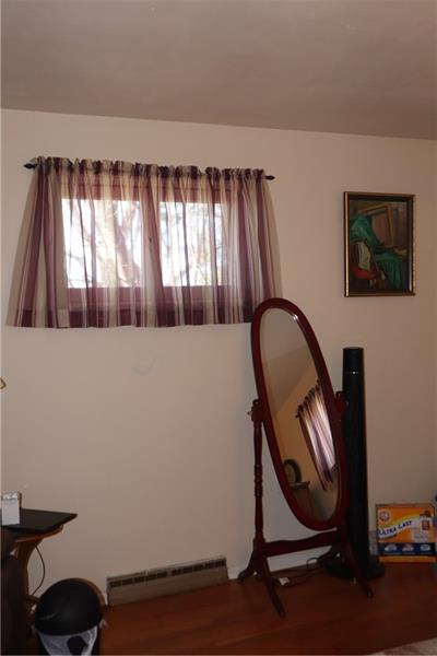 778 Katherine Street Rochester, PA 15074 - Photo 18 of 22 a room with a chair and a window