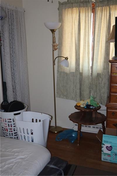 778 Katherine Street Rochester, PA 15074 - Photo 20 of 22 a bedroom with a bed and a table in it