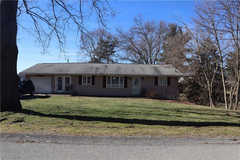 778 Katherine Street Rochester, PA 15074 - Photo 2 of 22 a front view of a house with a garden