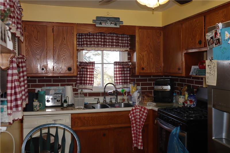 778 Katherine Street Rochester, PA 15074 - Photo 5 of 22 a kitchen with a sink cabinets and appliances