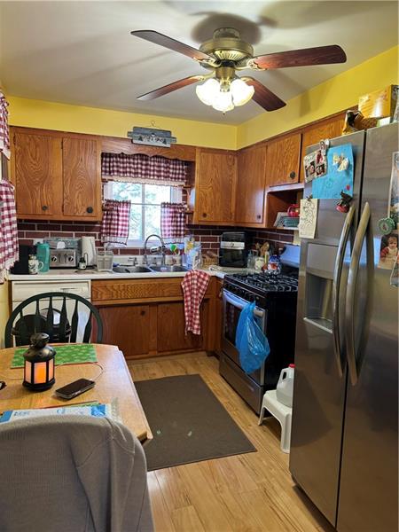 778 Katherine Street Rochester, PA 15074 - Photo 6 of 22 a kitchen with stainless steel appliances a stove a sink dishwasher and a refrigerator