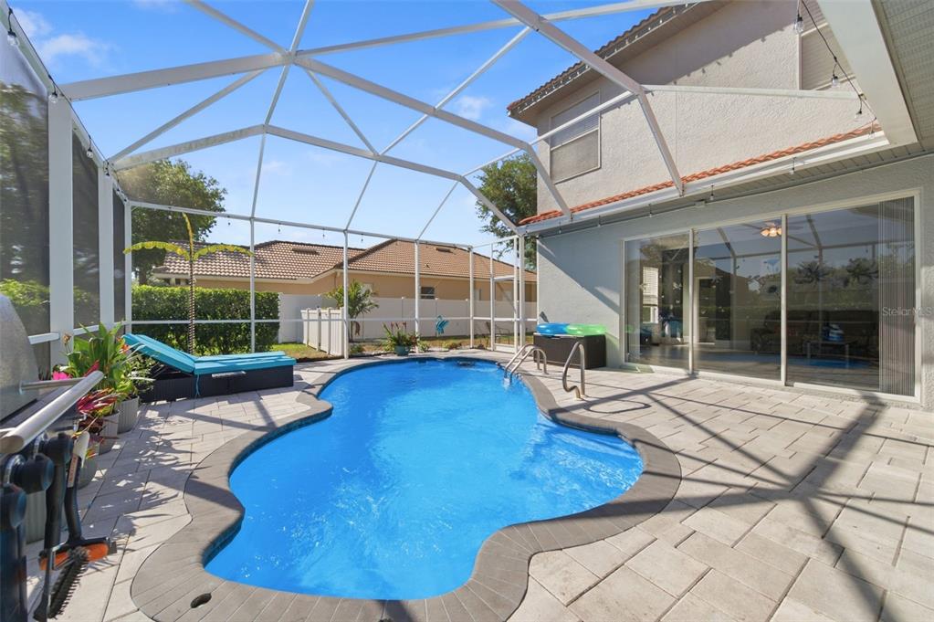 11508 Oyster Bay Circle New Port Richey, FL 34654 - Photo 2 of 98 a view of a house with backyard porch and sitting area
