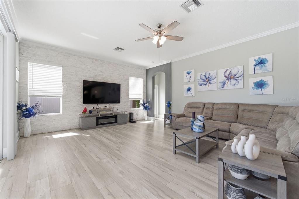 11508 Oyster Bay Circle New Port Richey, FL 34654 - Photo 31 of 98 a living room with furniture and a flat screen tv