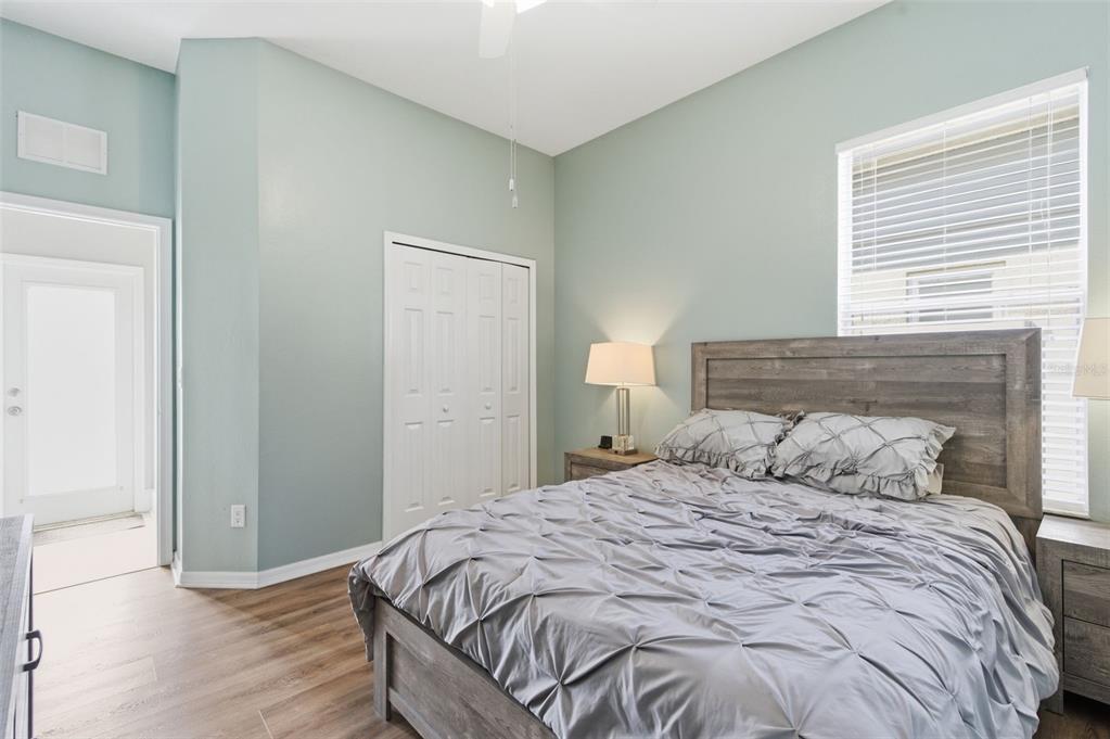 11508 Oyster Bay Circle New Port Richey, FL 34654 - Photo 43 of 98 a bedroom with a bed and wooden floor