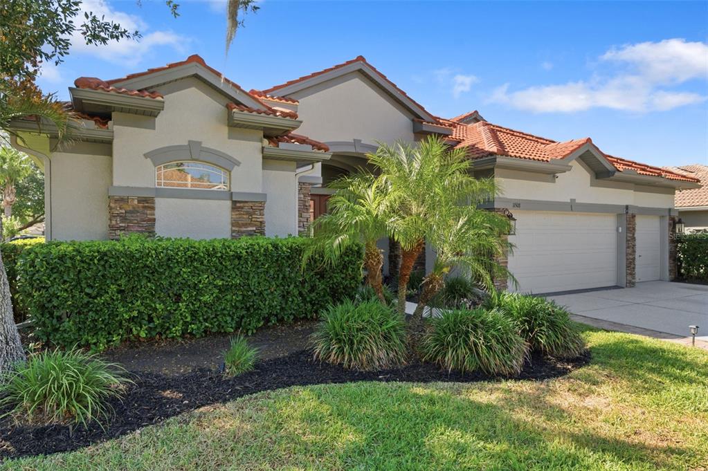 11508 Oyster Bay Circle New Port Richey, FL 34654 - Photo 5 of 98 a front view of a house with a yard
