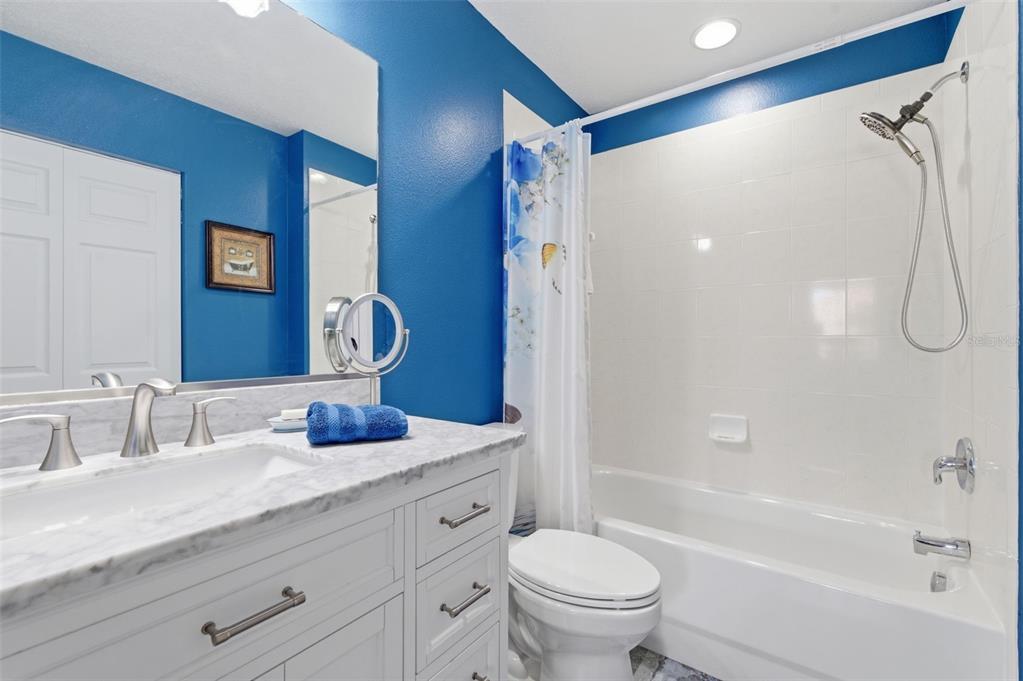 11508 Oyster Bay Circle New Port Richey, FL 34654 - Photo 56 of 98 a bathroom with a granite countertop sink a toilet and a bathtub