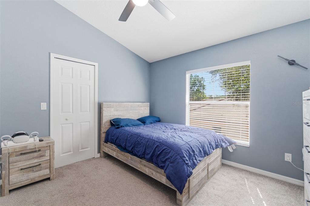 11508 Oyster Bay Circle New Port Richey, FL 34654 - Photo 62 of 98 a bedroom with a bed and a window