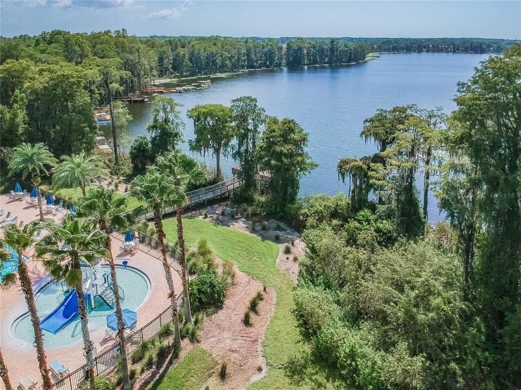11508 Oyster Bay Circle New Port Richey, FL 34654 - Photo 93 of 98 an aerial view of residential house with outdoor space and lake view