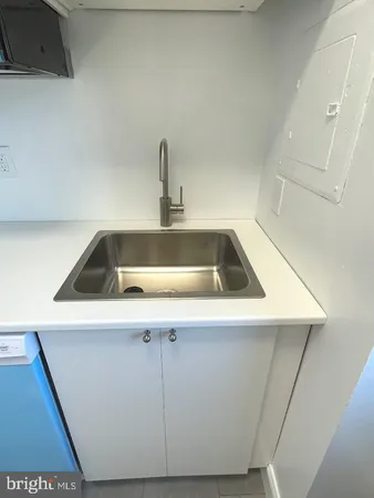 a white stove top oven sitting inside of a kitchen