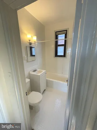 a bathroom with a shower and a bathtub