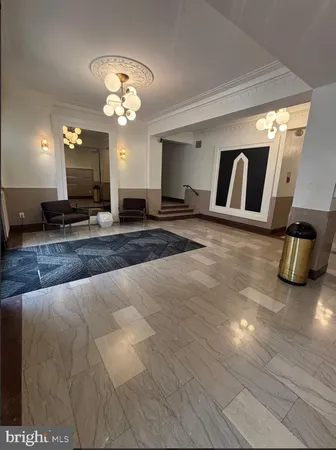 a view of a hallway with a chandelier