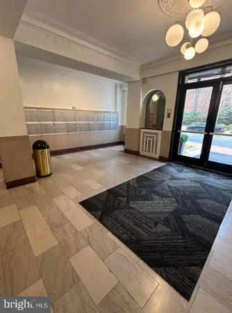 a view of a livingroom with furniture and staircase