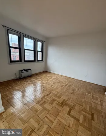 a view of an empty room and window