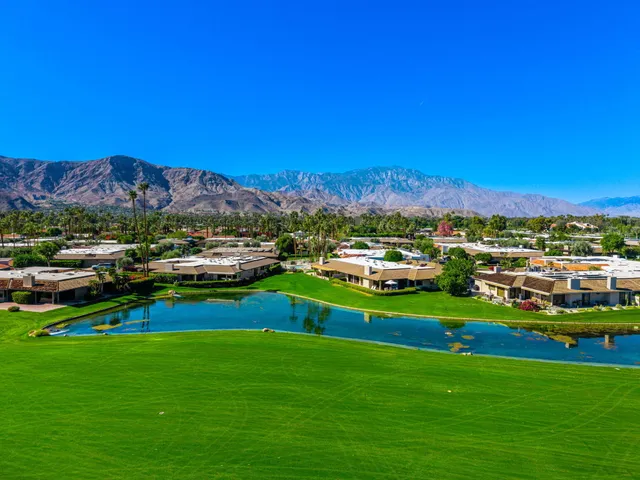 a view of a city with lawn chairs