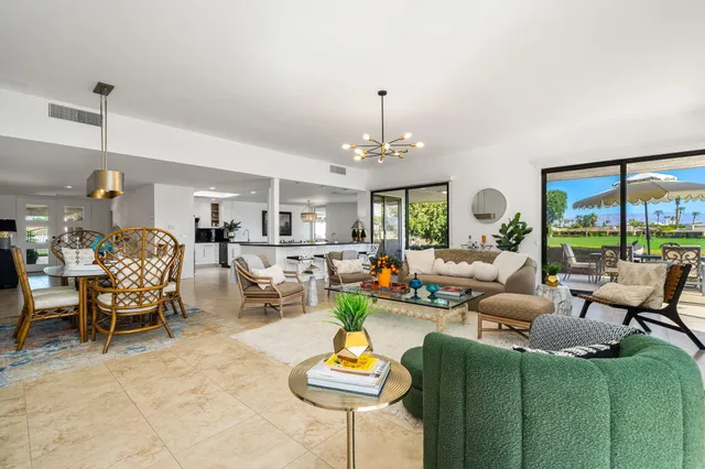 a kitchen with stainless steel appliances a refrigerator a stove a microwave and cabinets