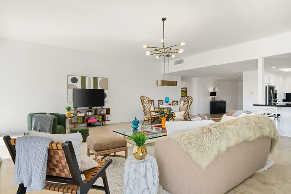 a kitchen with stainless steel appliances a refrigerator a stove a microwave and cabinets