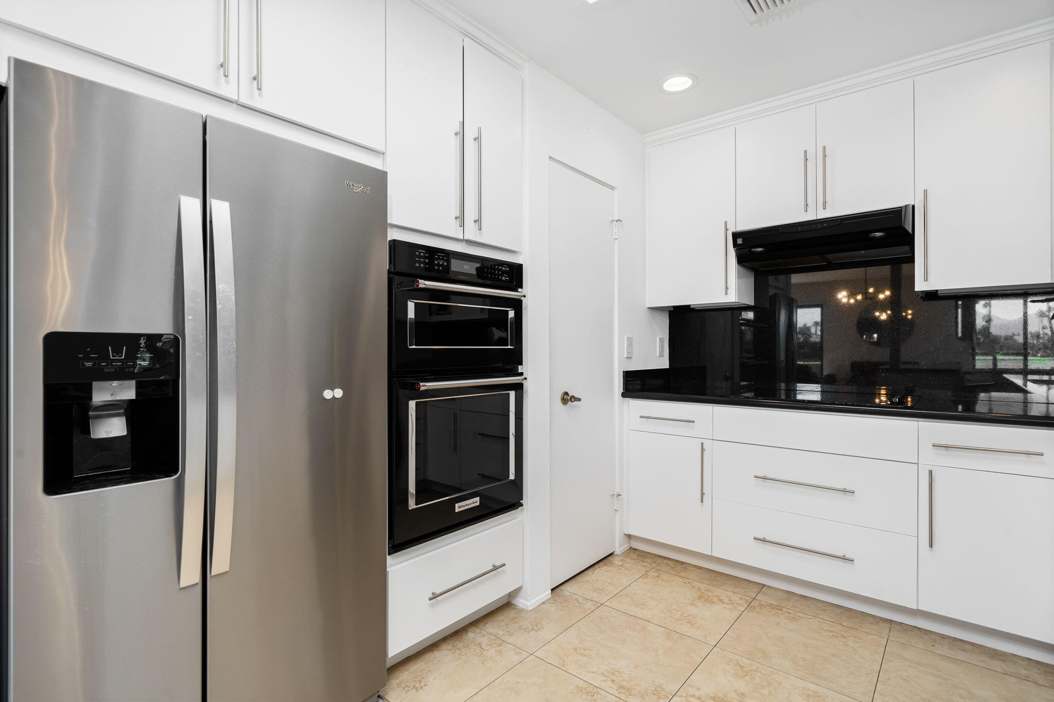 9 Rutgers Court Rancho Mirage, CA 92270 - Photo 27 of 53 a kitchen with stainless steel appliances a refrigerator a stove a microwave and cabinets