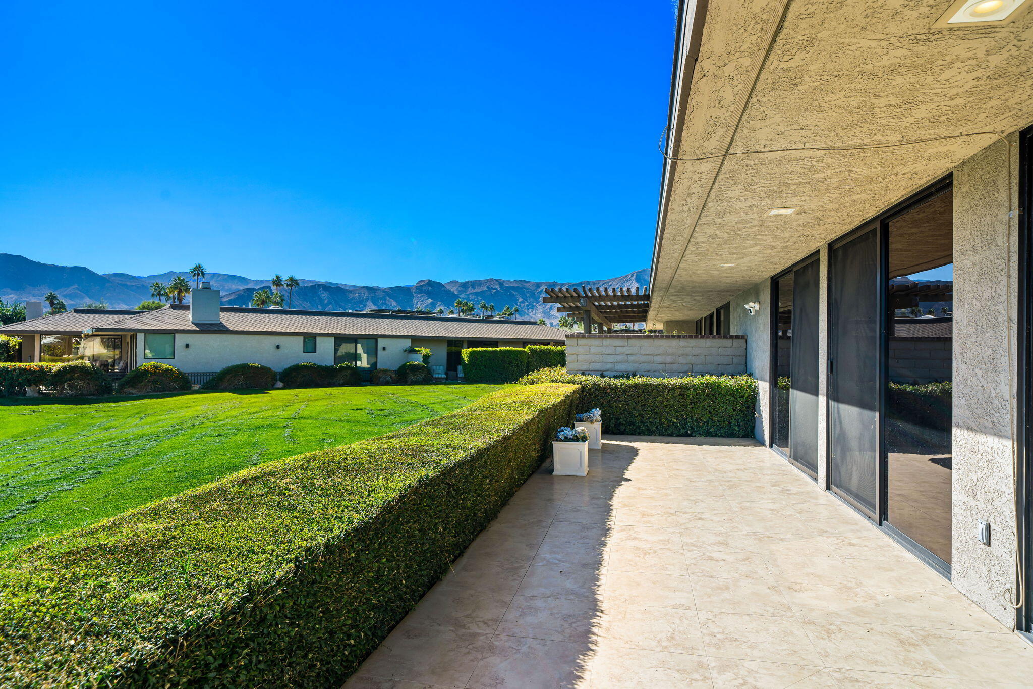 9 Rutgers Court Rancho Mirage, CA 92270 - Photo 36 of 53 a swimming pool with outdoor seating and yard