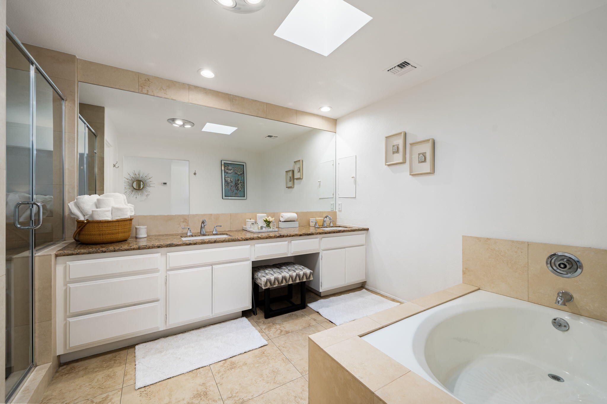 9 Rutgers Court Rancho Mirage, CA 92270 - Photo 41 of 53 a large bathroom with a tub a sink and a large mirror
