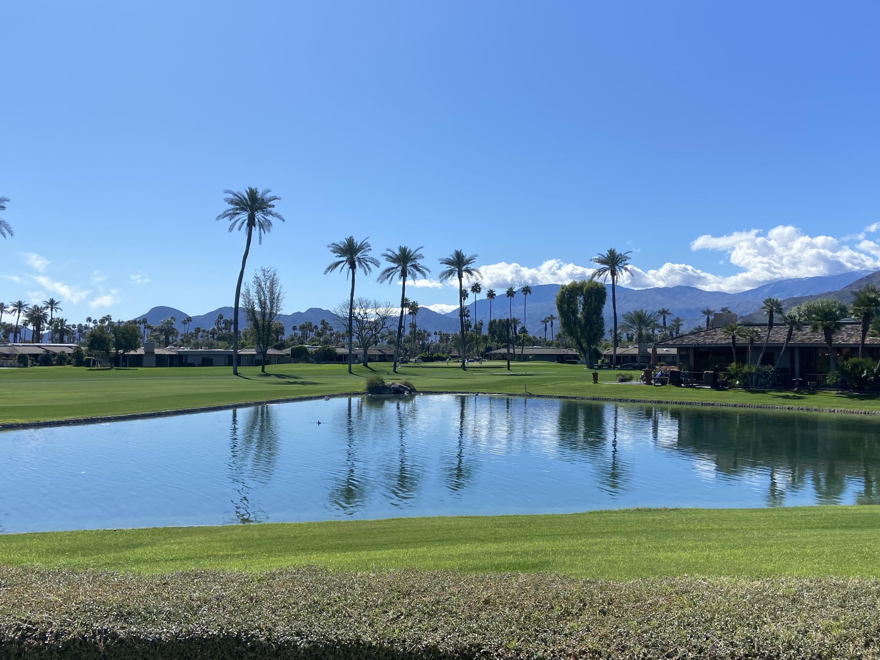 9 Rutgers Court Rancho Mirage, CA 92270 - Photo 50 of 53 a view of a lake with a house in the background