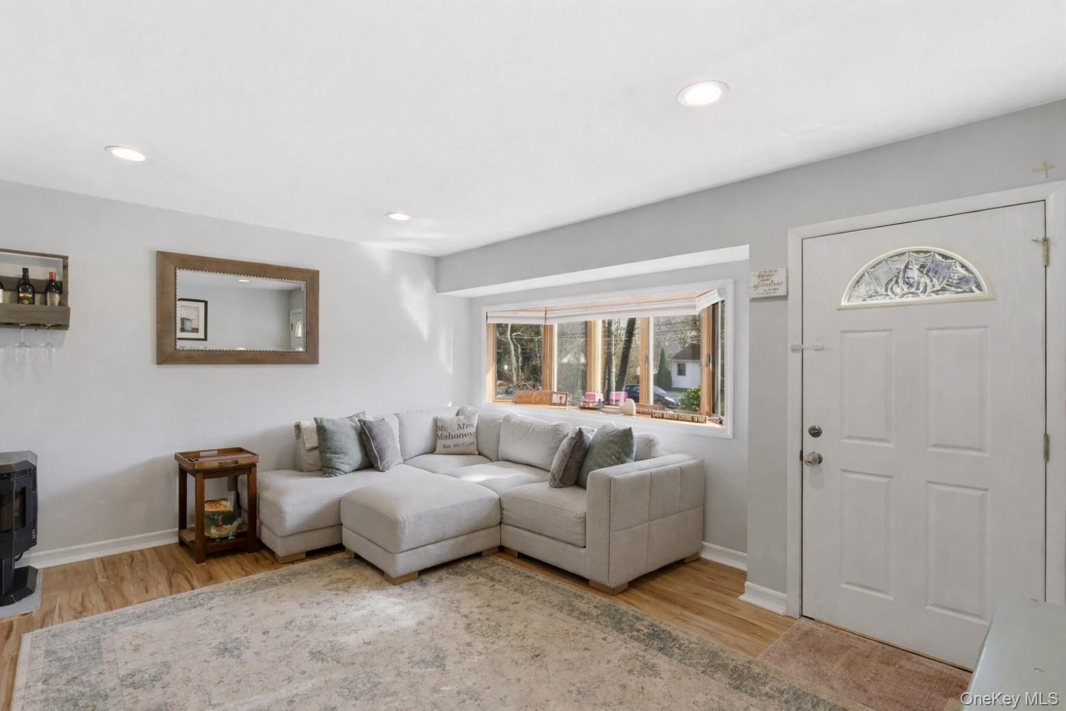 9 Fox Lane Shoreham, NY 11786 - Photo 3 of 13 a living room with furniture and a window