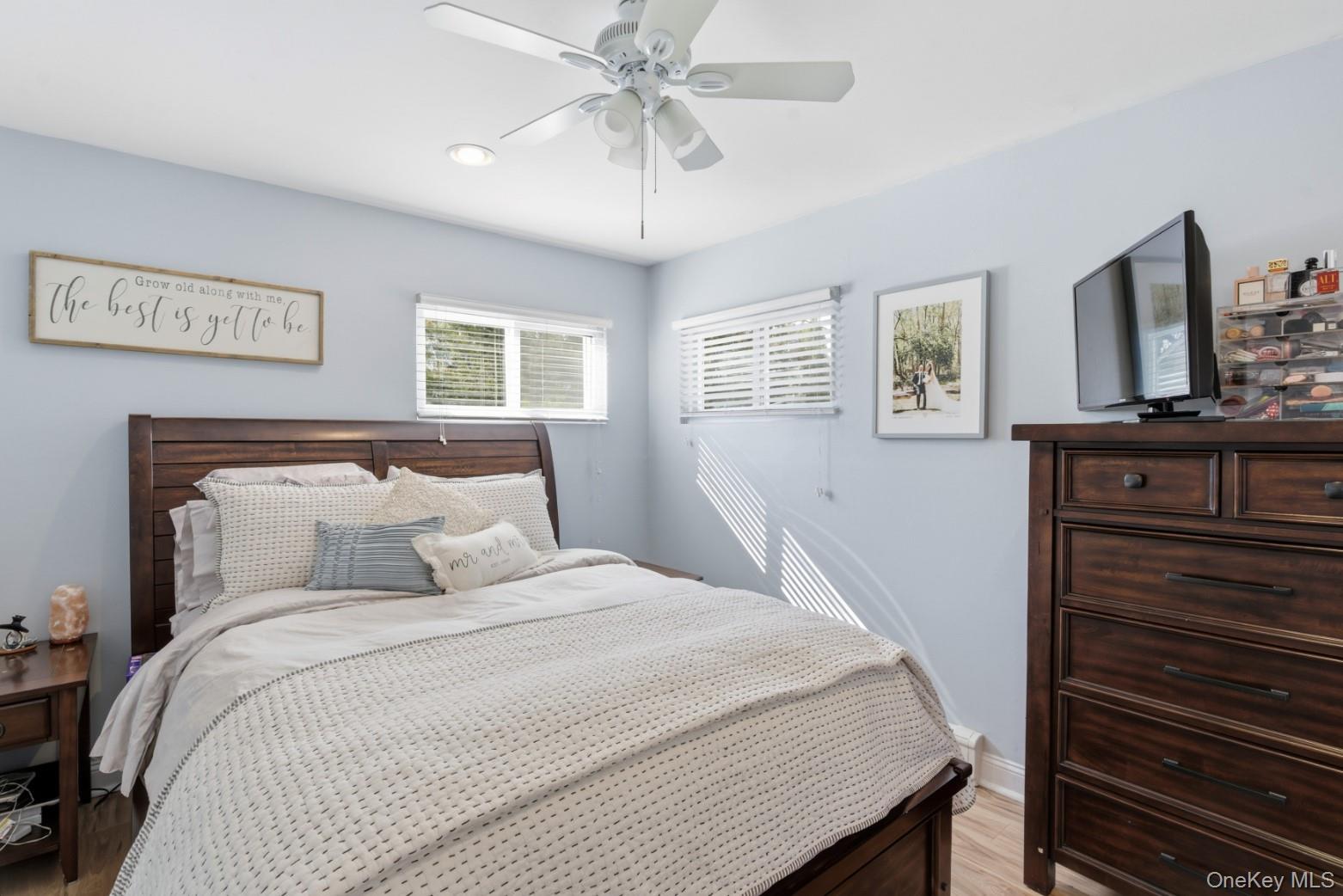 9 Fox Lane Shoreham, NY 11786 - Photo 6 of 13 a bedroom with a bed and a flat screen tv