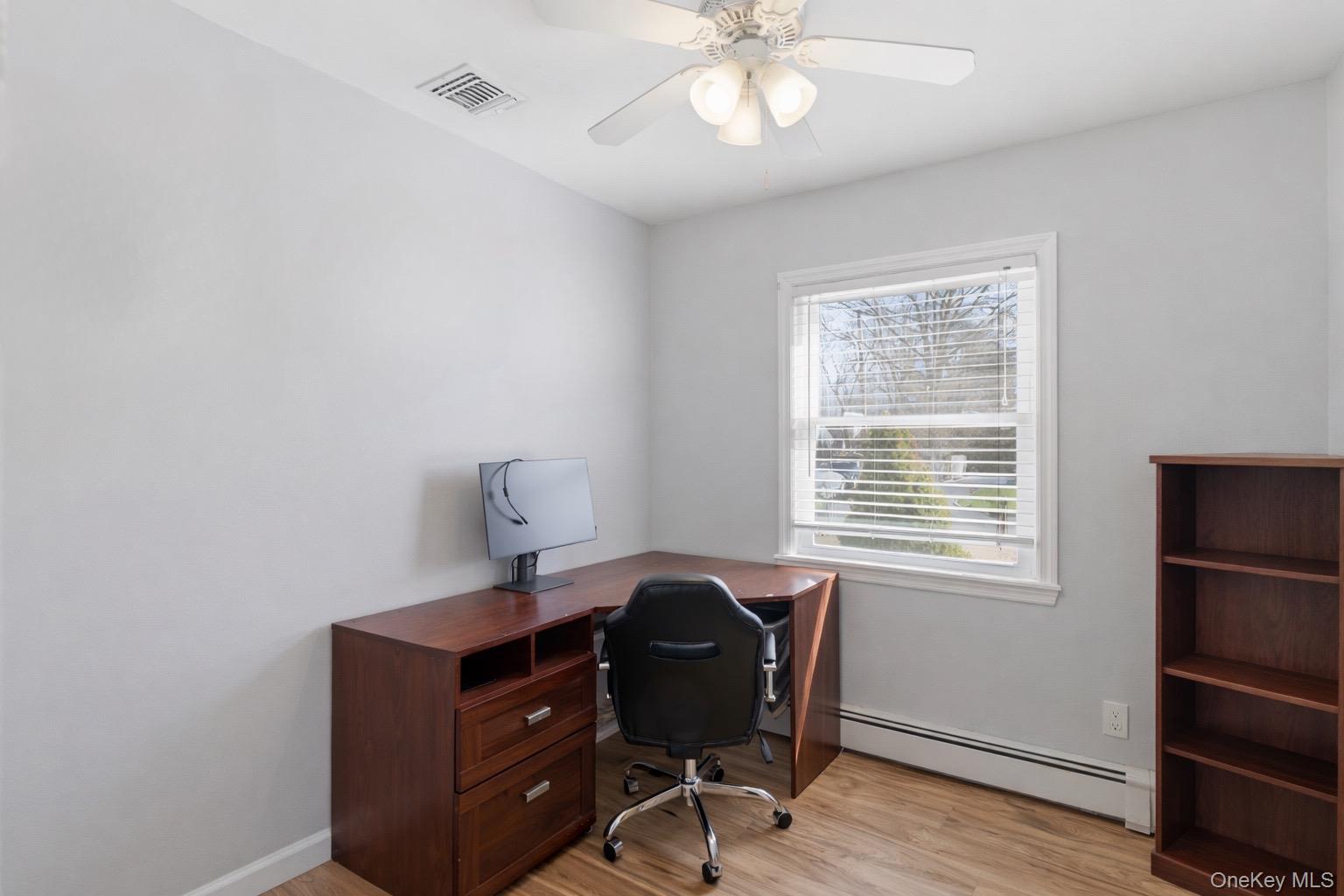 9 Fox Lane Shoreham, NY 11786 - Photo 9 of 13 a view of a workspace with furniture and a window