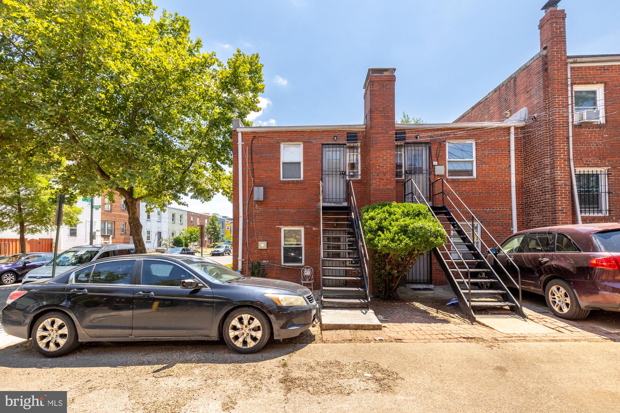 1520-1524 Queen Street Northeast Washington, DC 20002 - Photo 19 of 19 a front view of a house with parking area